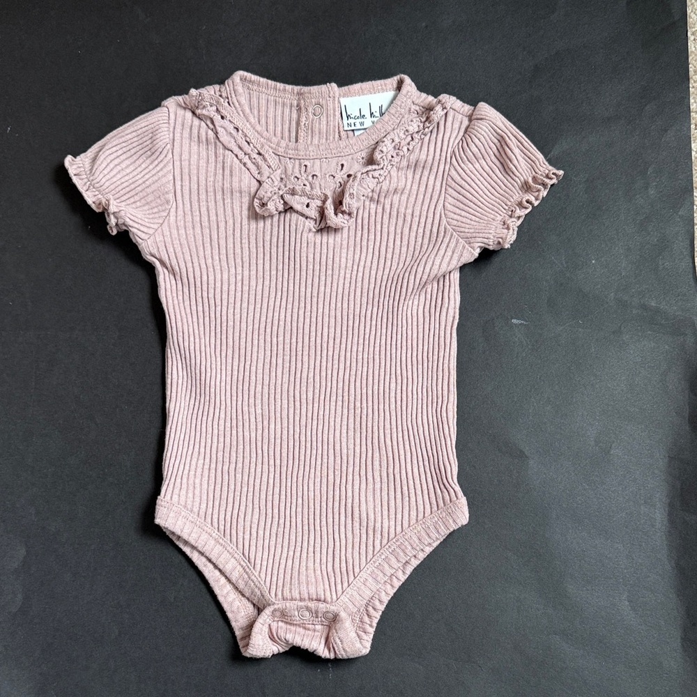 Nichole Miller Dusty Rose Ribbed Short-Sleeve Baby Bodysuit with Ruffle Trim.